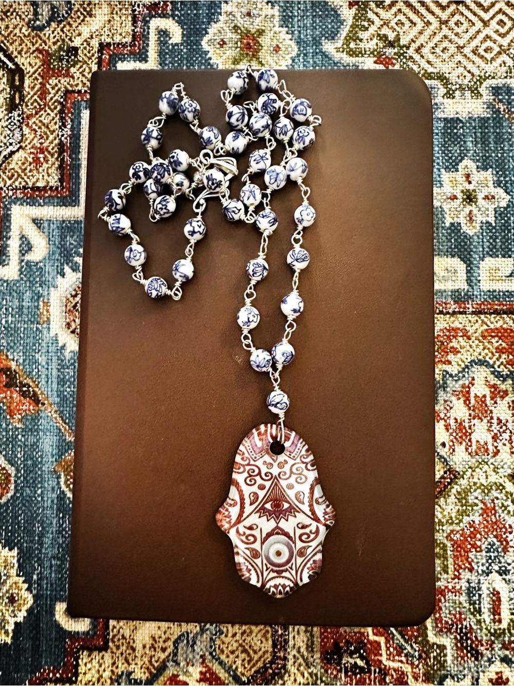 Glass Hamsa Hand Necklace with blue & white porcelain beads